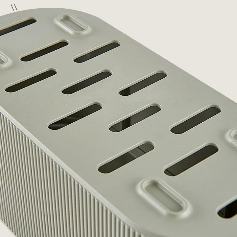 Vue du dessus de la boite de rangement multiprise avec ouvertures de ventilation intégrées