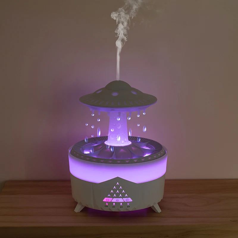 Diffuseur d’arômes effet pluie OVNI avec éclairage violet et diffusion de brume relaxante