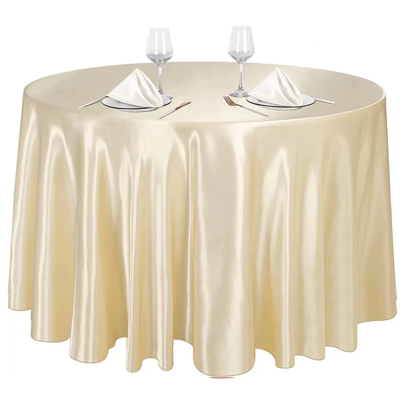 Nappe ronde satinée couleur champagne pour table élégante et décoration de réception.