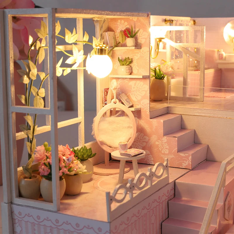 Coin lecture miniature rose avec fauteuil suspendu, plantes et escalier intérieur