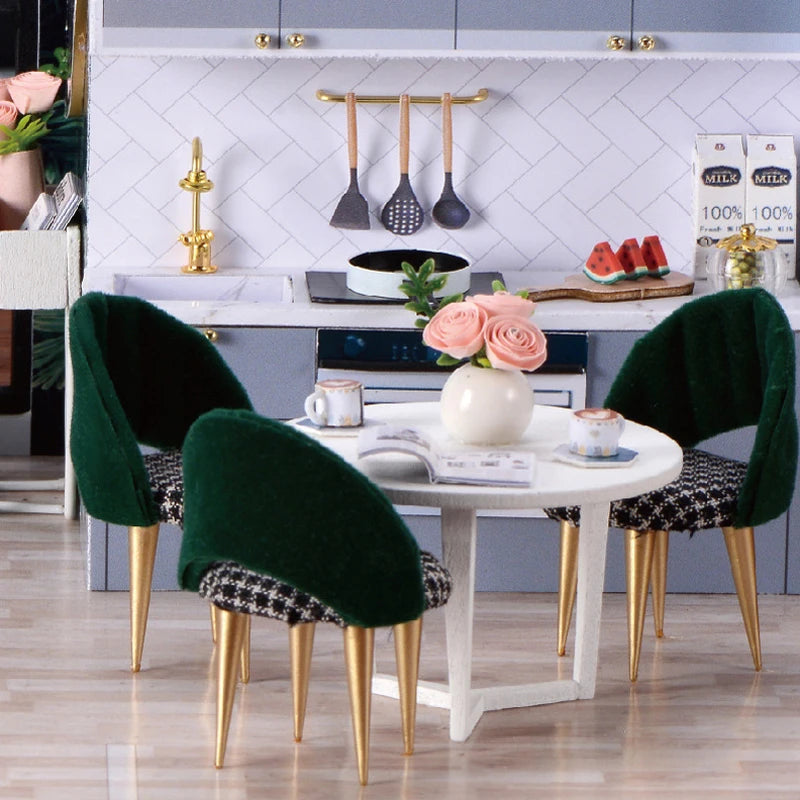 Cuisine miniature moderne avec table ronde et chaises décoratives