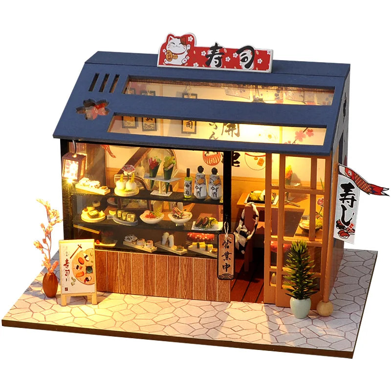 Maquette de restaurant sushi miniature avec vitrine éclairée et façade japonaise