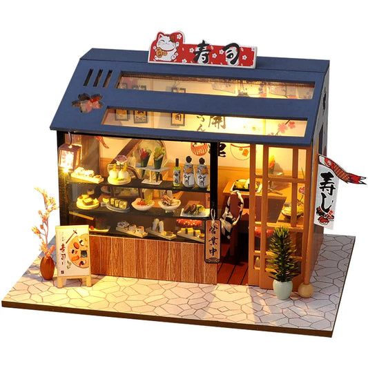 Maquette de restaurant sushi miniature avec vitrine éclairée et façade japonaise